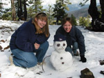 Lucy and Debbie with a snowman in the Troodos Mountains
