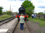 Lucy standing in the path of 5322 at the Didcot Railway Centre