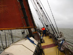 Setting the topping-lift on schooner Trinovante