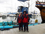 Lucy and Stephen by the Orca Sea Safaris boat in Falmouth harbour