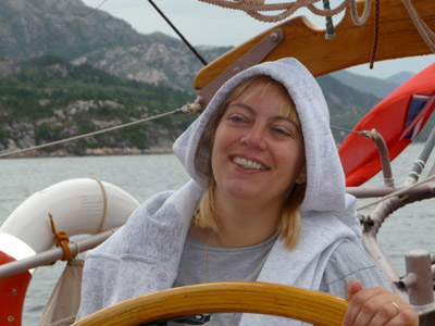 Lucy steering schooner Trinovante during a week's sailing in Norway